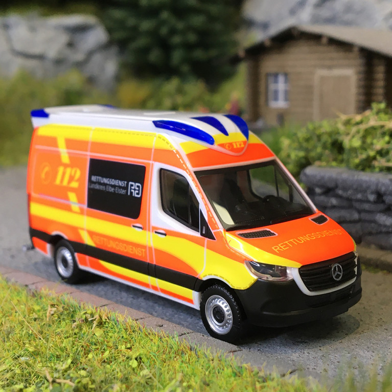 Mercedes Sprinter '18, Ambulance, service médical d'urgence du distric d'Elbe-Elster, Brandebourg - HERPA 099042 - HO 1/87